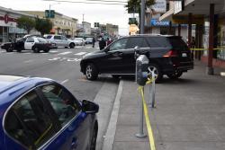 Vehicle Reverses onto Sidewalk Causing Pedestrian Injury