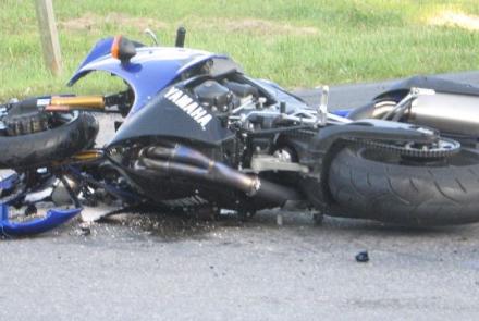 damaged motorcycle in road