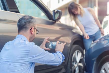 Car Accident Victim Documenting Property Damage